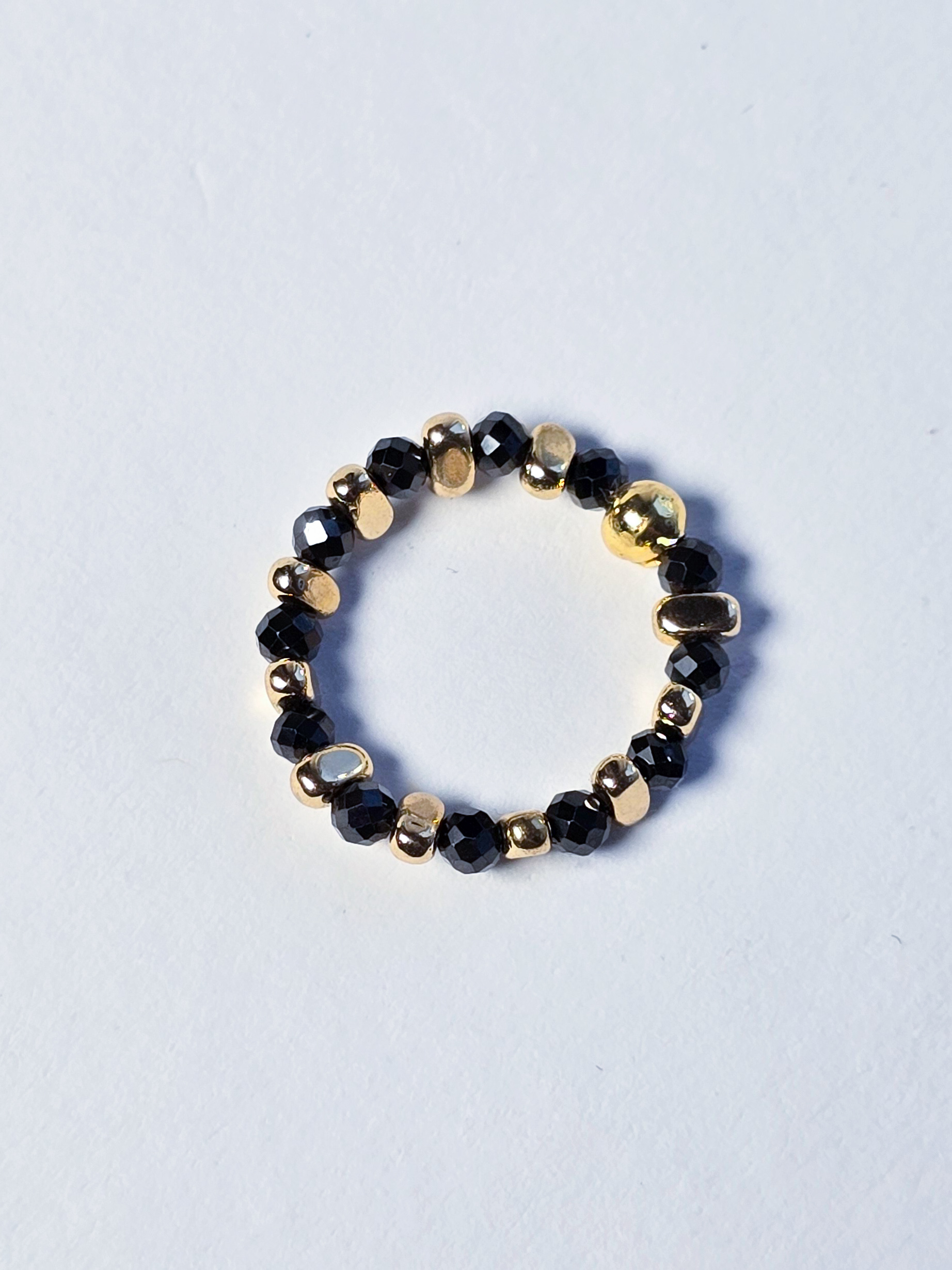 Кабулучка на еластичній основі №10 Чорний циркон та золотий гематит